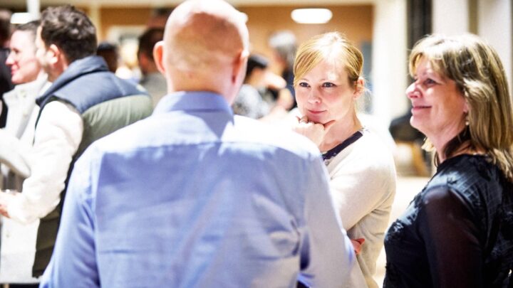 People learning from the insights of an IT consultant