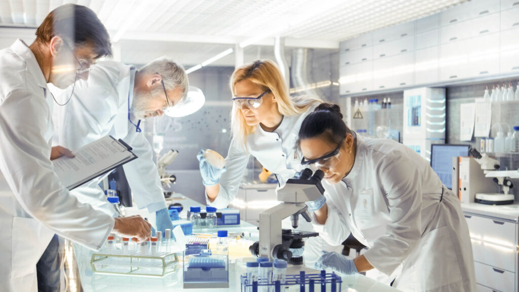 Medical research scientists conducting experiments and analyzing results in a laboratory