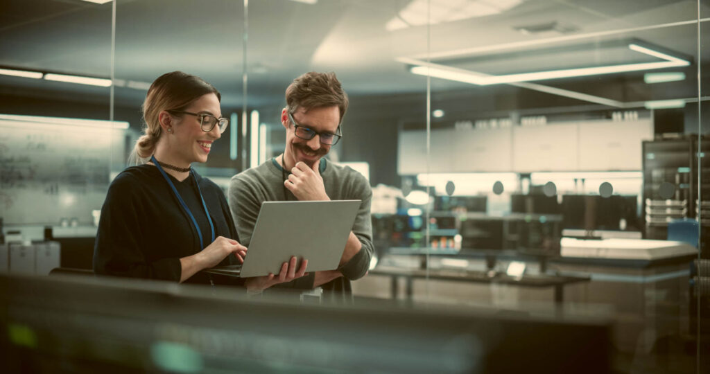 Engineers working together on a laptop